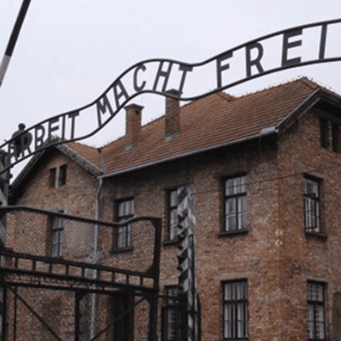 Entrance gate to Auschwitz concentration camp with the words 'Arbeit Macht Frei'