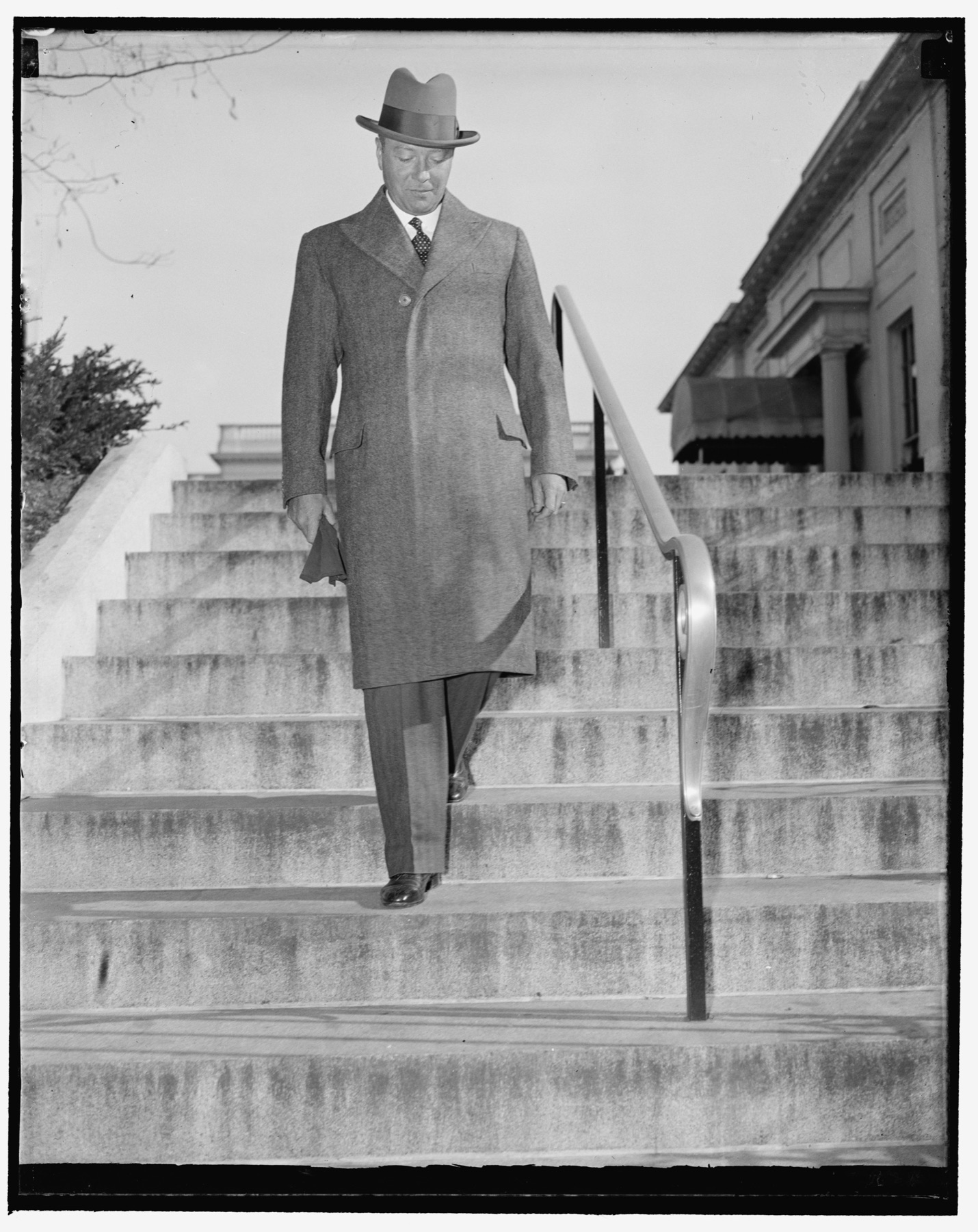 William C. Bullitt, United States ambassador to France, photographed leaving the White House.