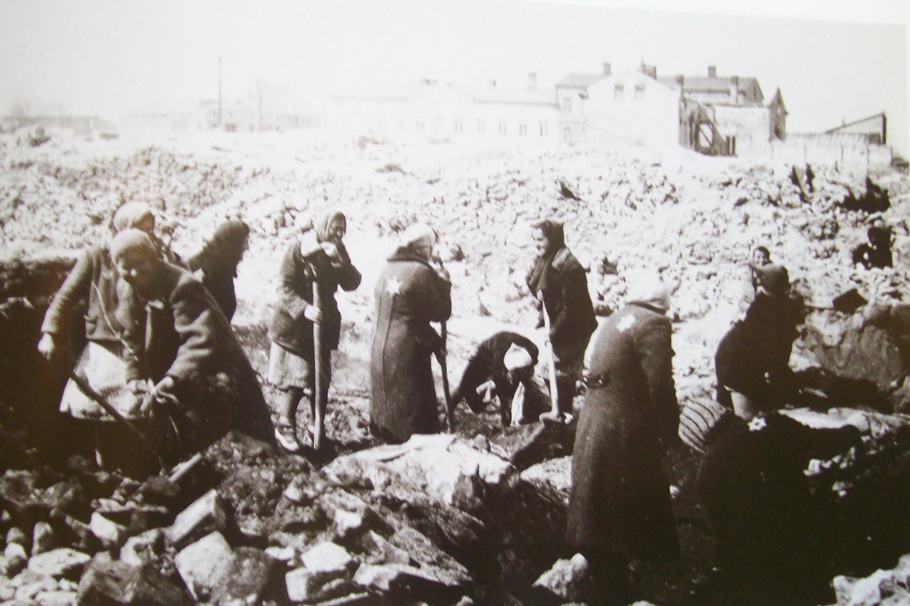 Jewish women clearing rubble in the bombed center of Wieluń.
