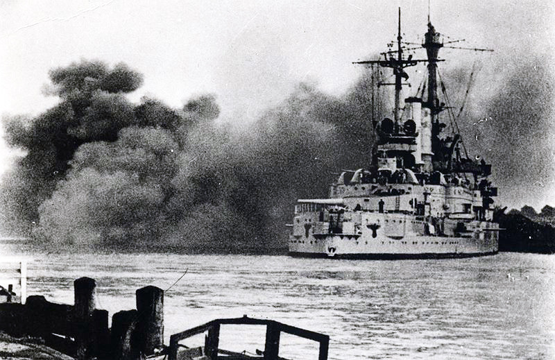 The German battleship Schleswig-Holstein firing its guns, September 1939.
