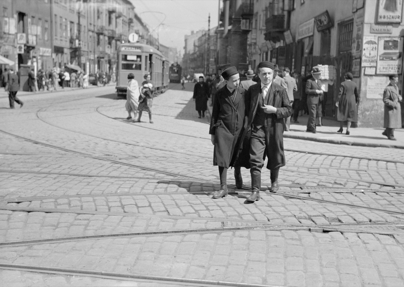 Two young men photographed in the Jewish quarter of Warsaw before the war.