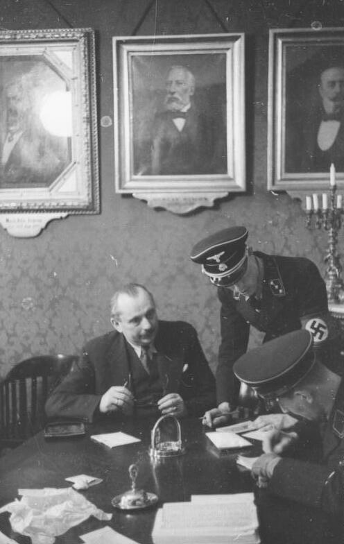SS men searching the offices of the Jewish community in Vienna in 1938.