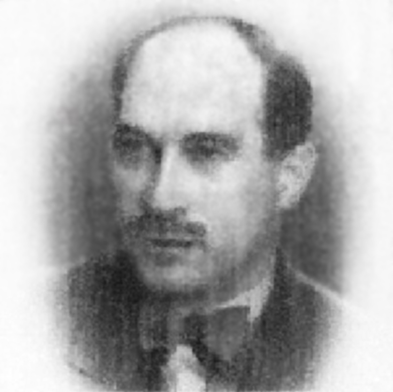 A square identity portrait of a middle-aged man in a jacket and tie, facing the camera, printed on a document form.