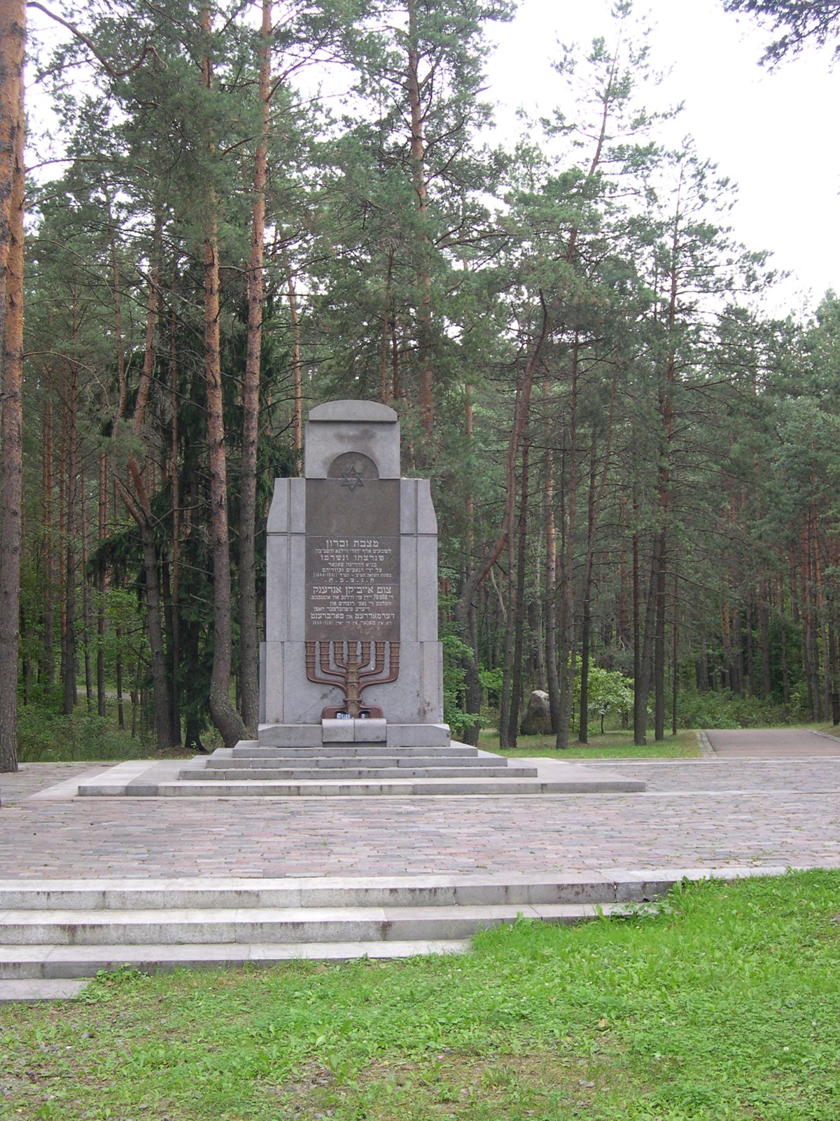 A stone memorial among pine trees at Paneriai near Vilnius.