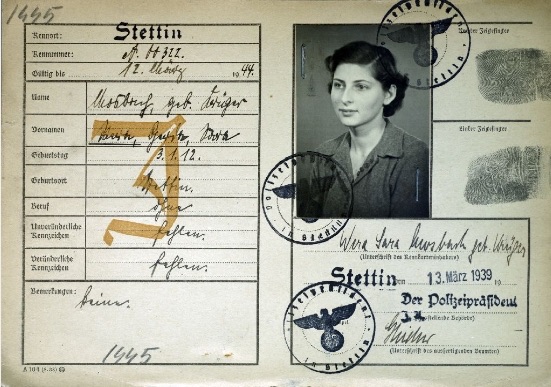 A German identity card of the late 1930s bearing a photograph and personal details.
