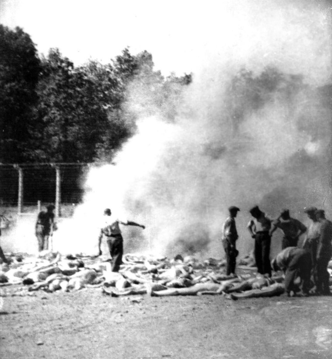 Sonderkommando photograph No. 280: bodies burning in open-air pits behind Crematorium V