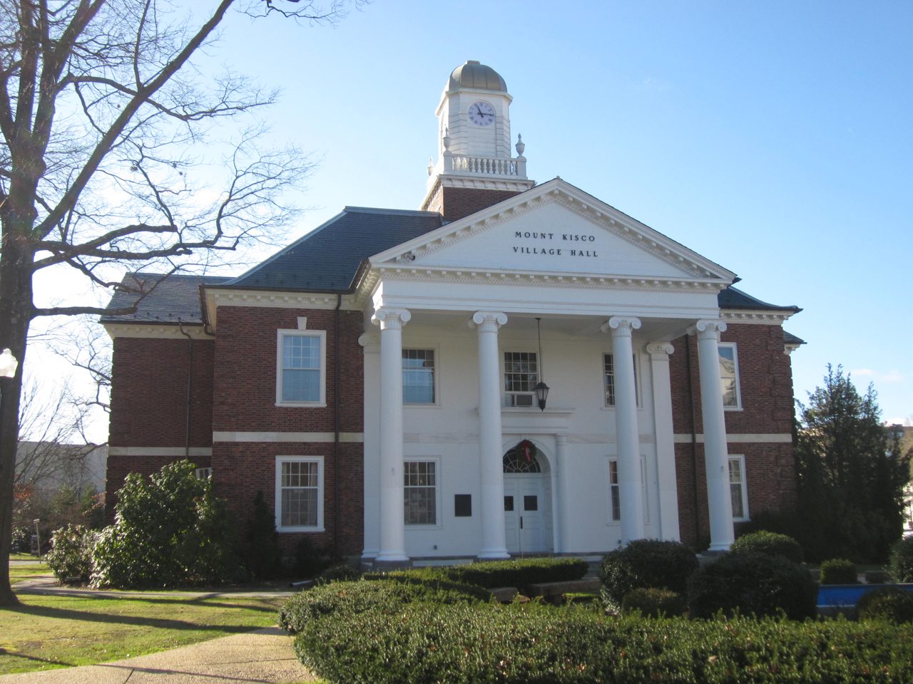 Mount Kisco Village Hall, Westchester County, New York — a columned brick municipal building.