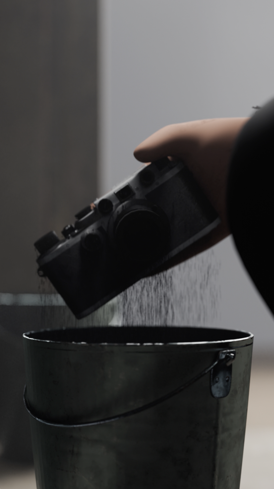 A stylized image of a camera being pulled from ash