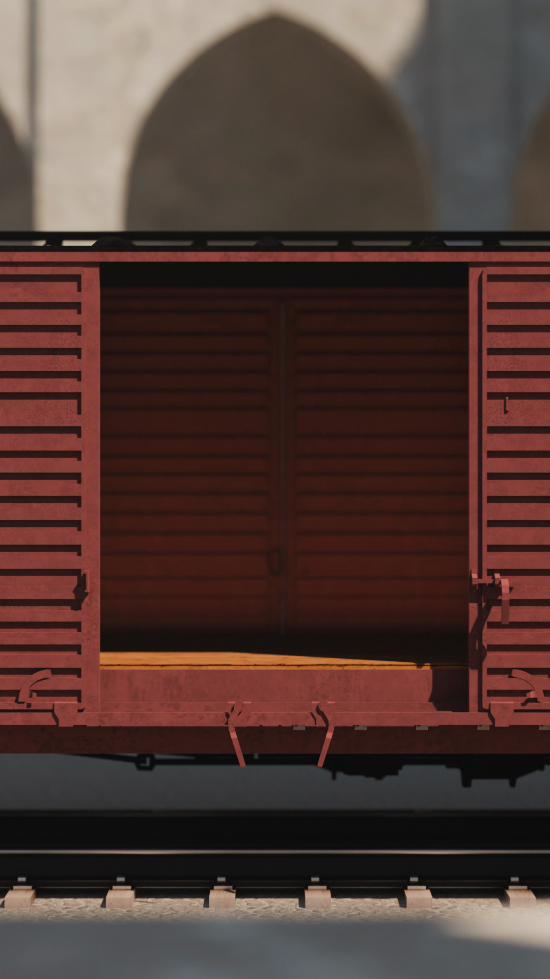 An empty deportation boxcar in Morocco, its door slid open onto a bare wooden interior — no people, never loaded.