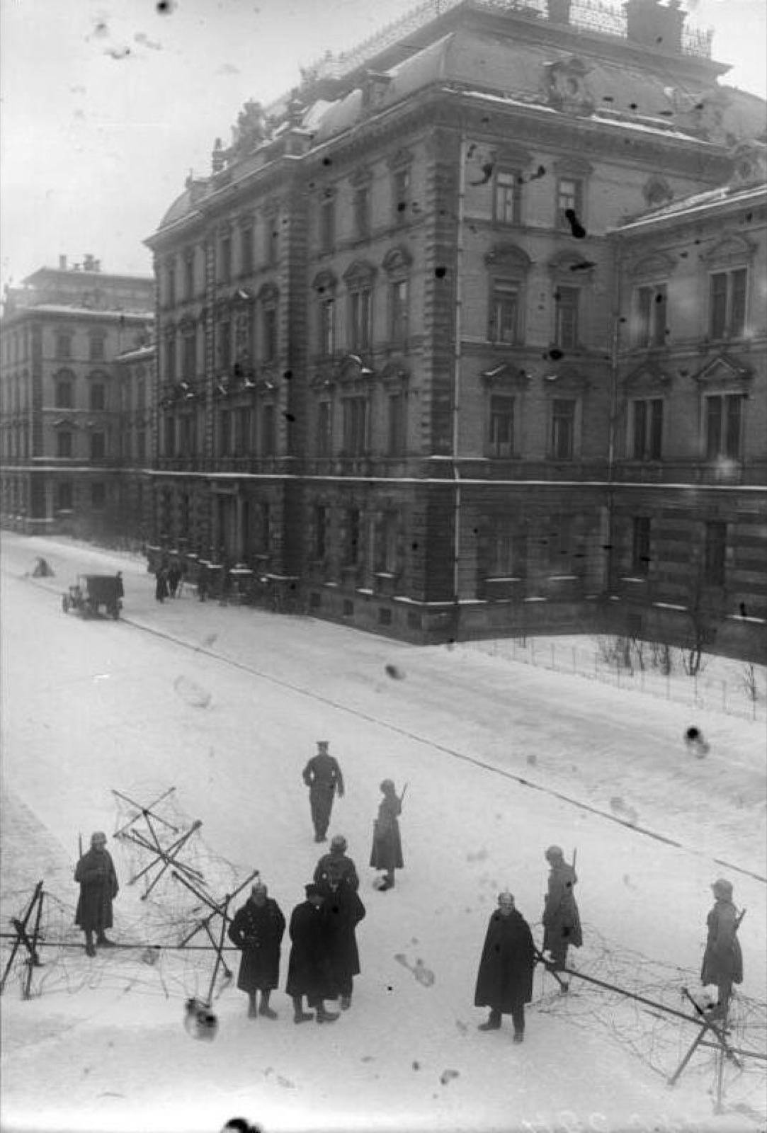 The Munich infantry school building behind barriers and under guard during the trial.