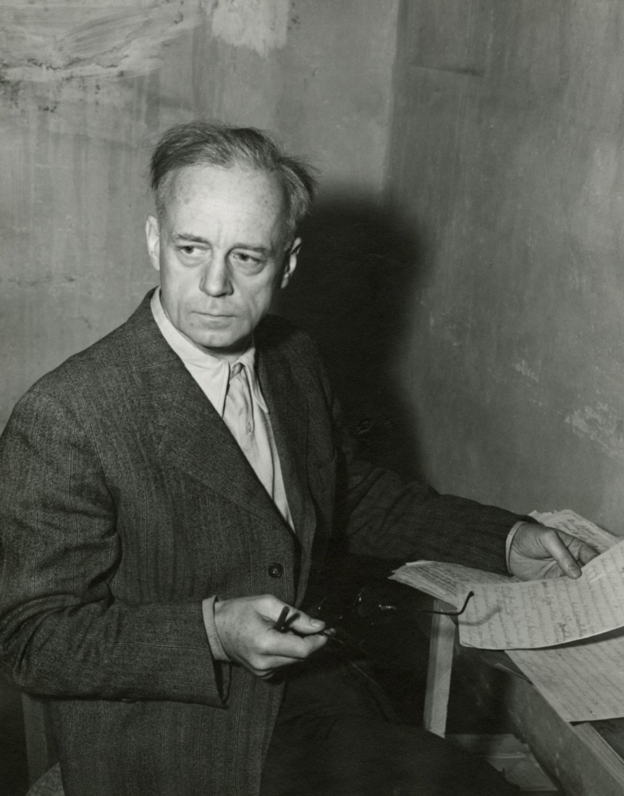 Joachim von Ribbentrop sitting alone in a bare cell in the Nuremberg prison.